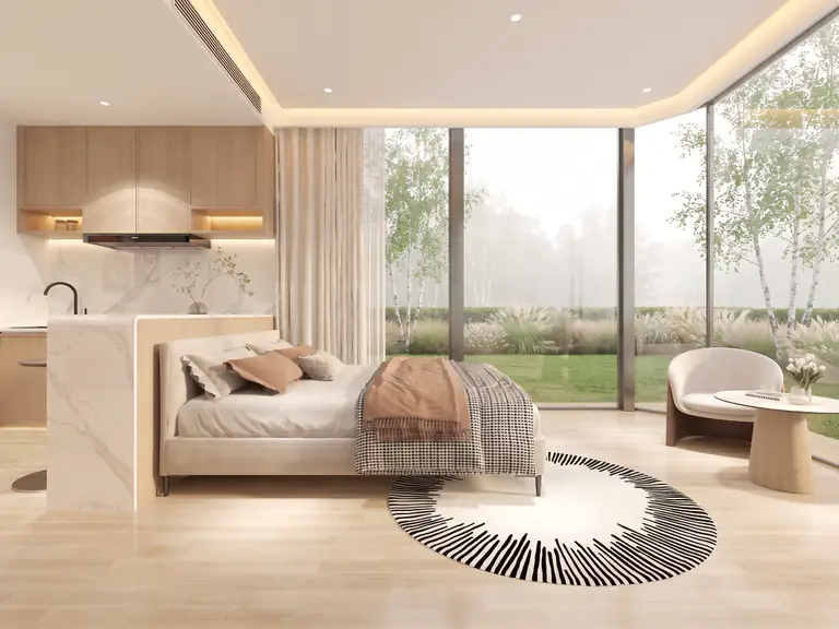 Capsule bedroom: bed behind a marble counter, armchair by the corner panoramic glazing