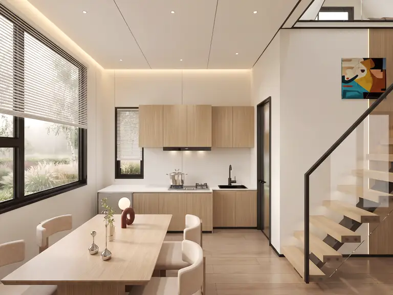 Prism dining room by a window with blinds, kitchen and stairs with a glass balustrade