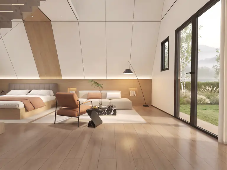 Prism suite: bed and modular sofa beside the sliding glass wall with a garden view